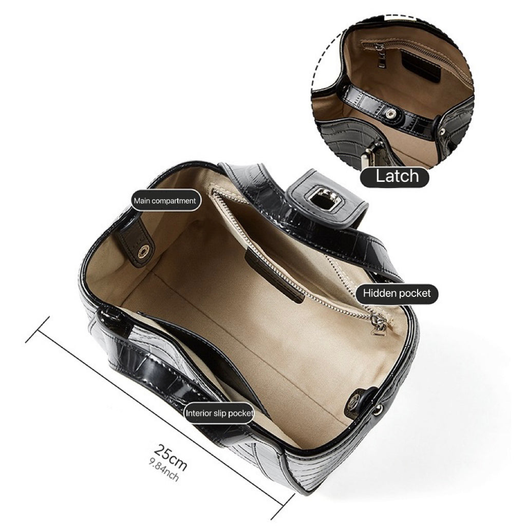 Krokodilpräglad läderväska med spänne och handtag