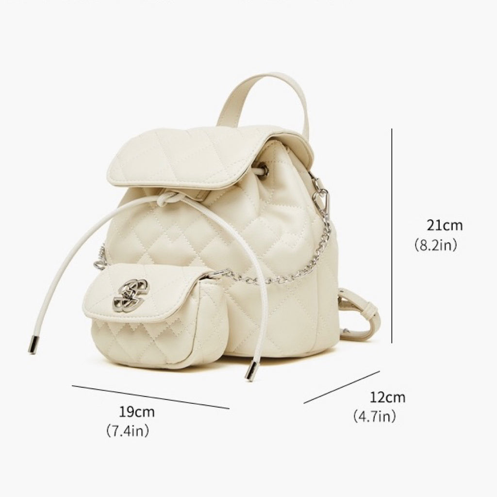 Elegant diamantbeklädd miniryggsäck i äkta läder med avtagbar ficka