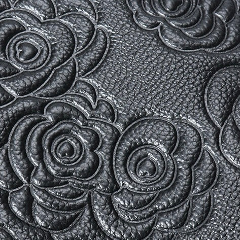 Äkta läderväska med rosprägling och avtagbar rem