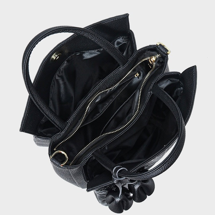 Äkta läderväska med rosprägling och avtagbar rem