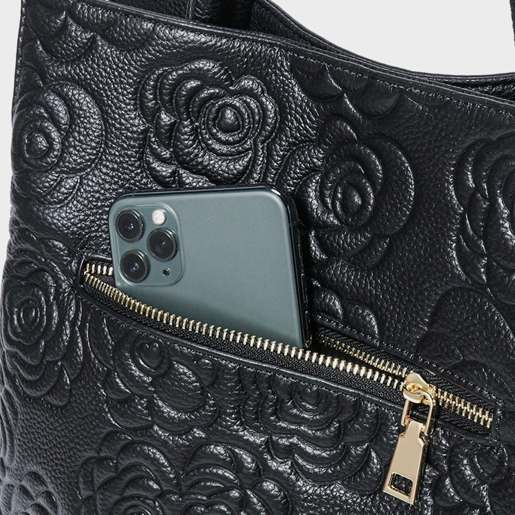 Äkta läderväska med rosprägling och avtagbar rem