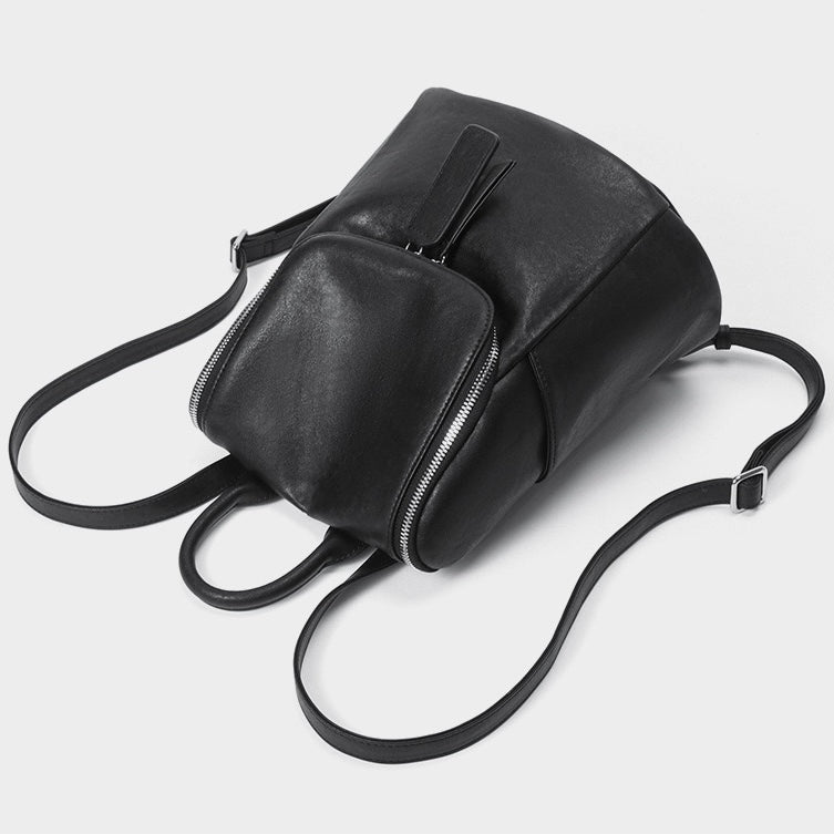 Minimalistisk tidlös krämig ryggsäck i äkta läder