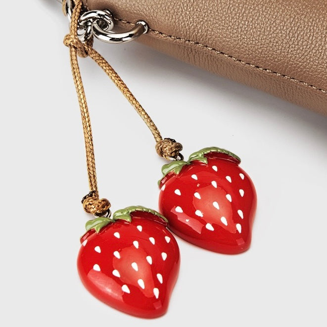 Mini-axelväska i äkta läder med hink och telefon