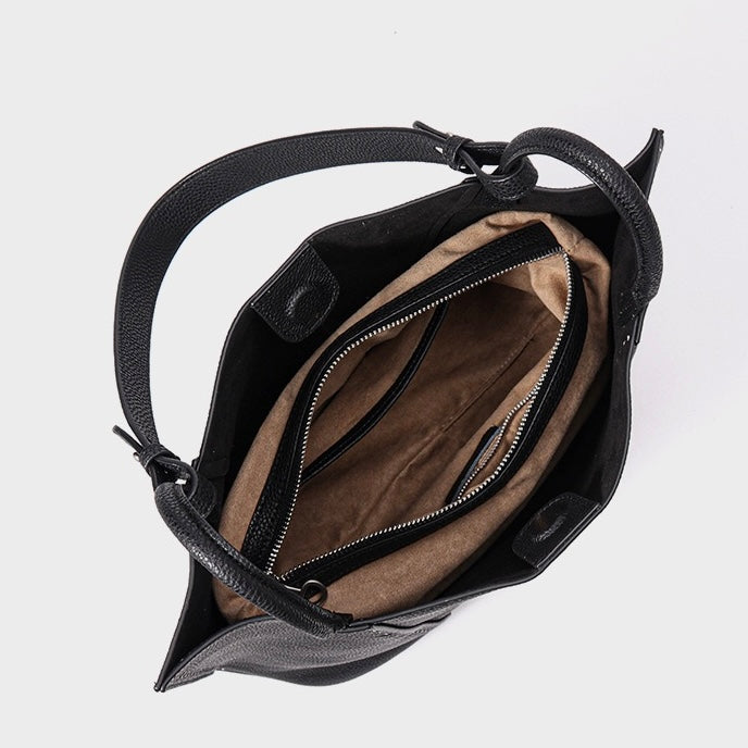 Kontrastsömmar texturerade tygväskor i äkta läder