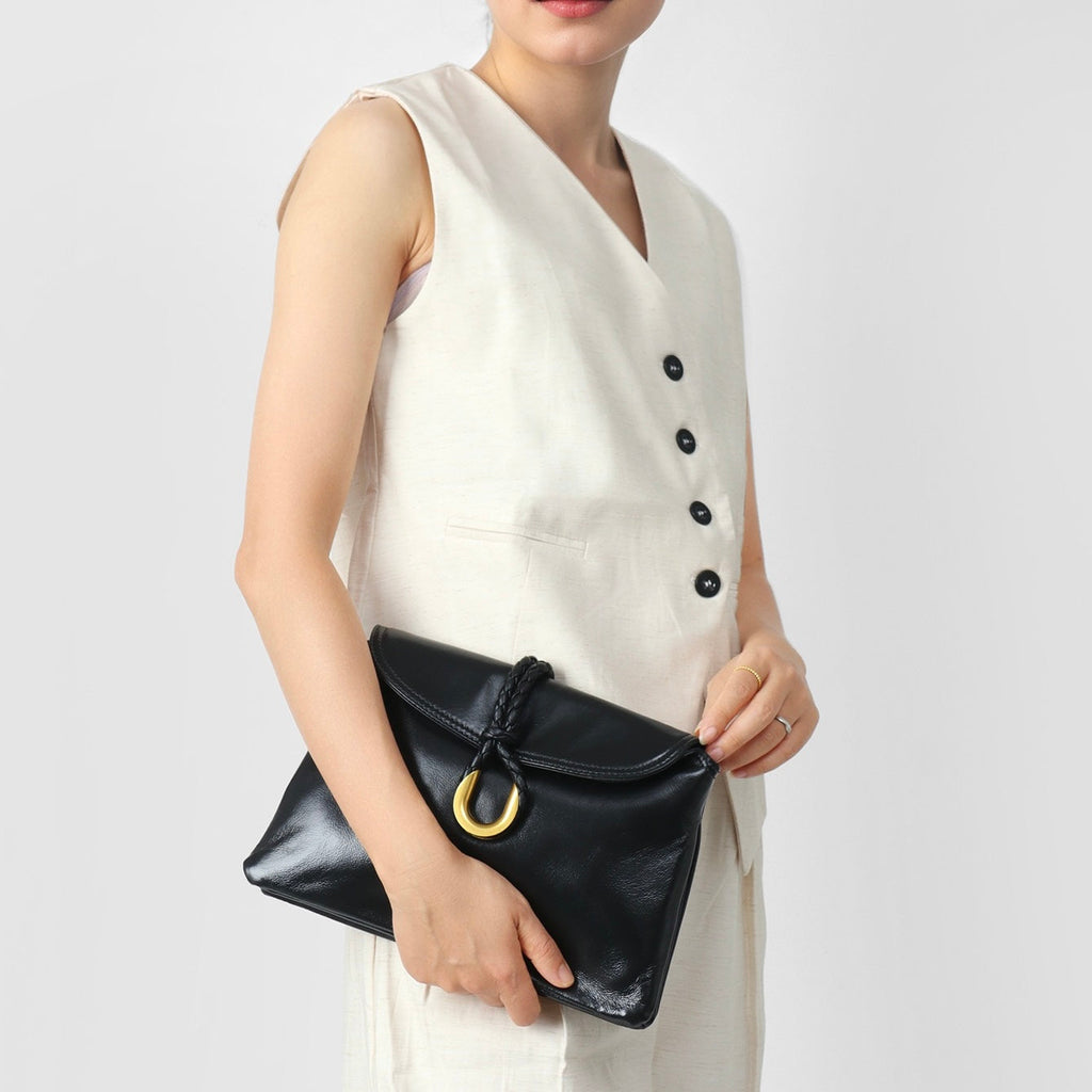 Lyxig flätad kuvertformad axelväska i läder