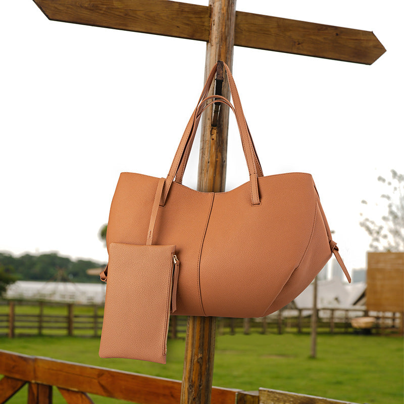Elegant tygväska i äkta läder med pebbled läderficka